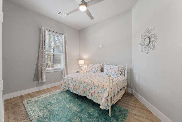 bedroom featuring hardwood / wood-style flooring and ceiling fan