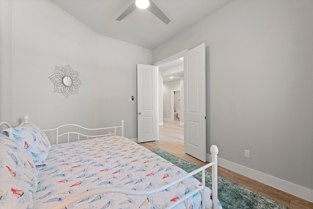 bedroom with light wood-type flooring and ceiling fan