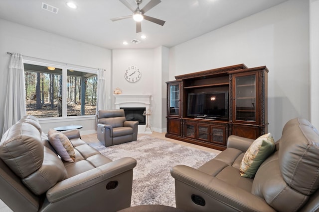 63 Shetland Ln, Coldspring, TX 77331 - living room with ceiling fan, a fireplace, recessed lighting, wood finished floors, and baseboards