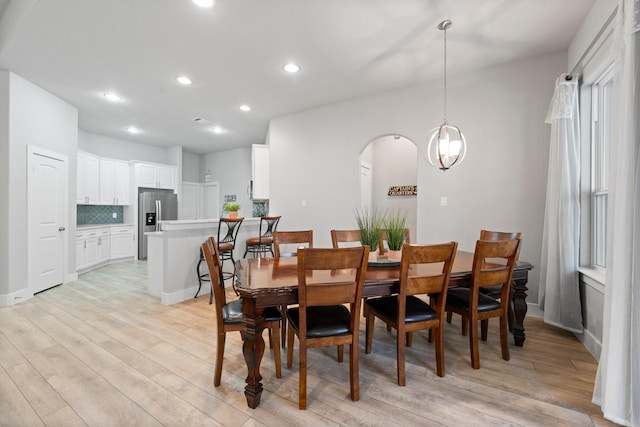 63 Shetland Ln, Coldspring, TX 77331 - dining space featuring light wood-style flooring, recessed lighting, arched walkways, and baseboards