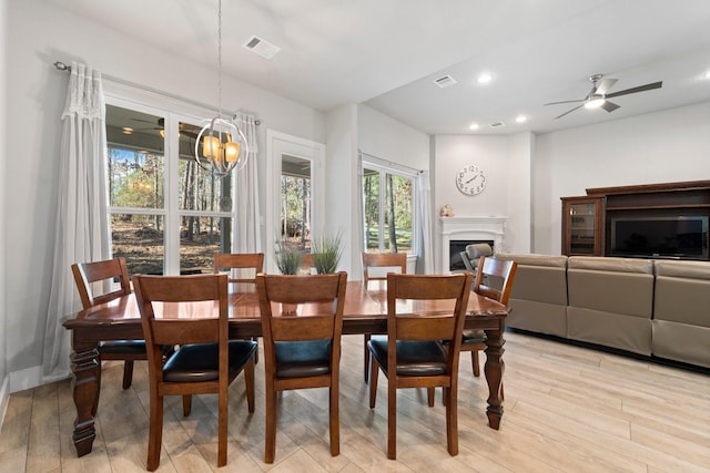 63 Shetland Ln, Coldspring, TX 77331 - dining space featuring recessed lighting, a fireplace, light wood-type flooring, and a ceiling fan