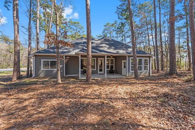 back of property with a patio