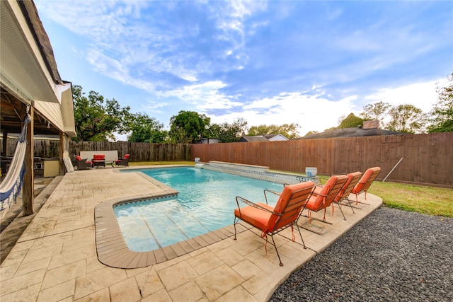 view of swimming pool featuring a patio