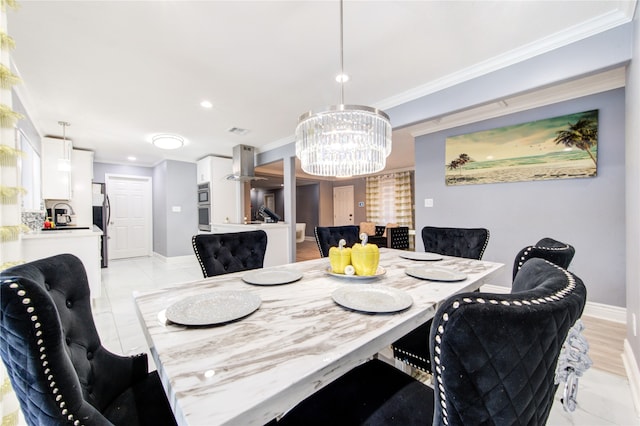 dining room with crown molding and a notable chandelier