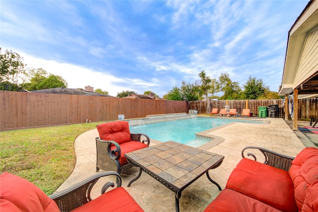 view of pool featuring a patio, a lawn, and pool water feature