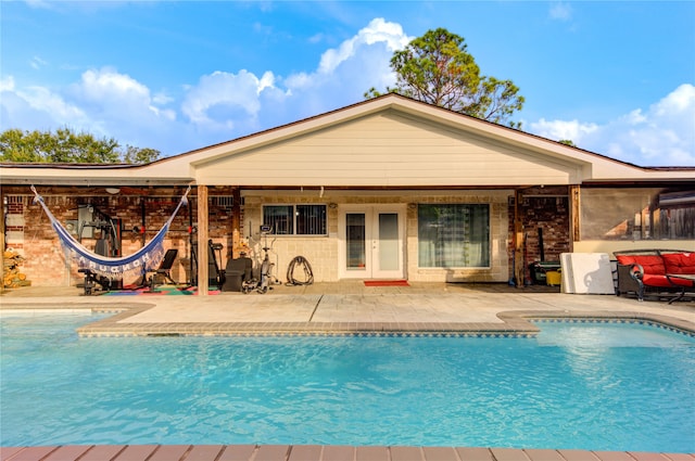 view of swimming pool featuring a patio