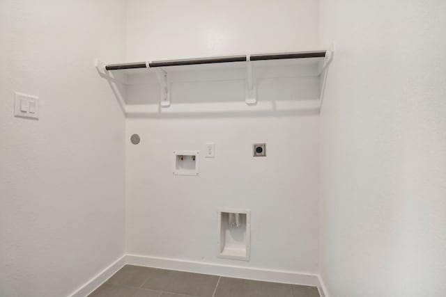 laundry room with laundry area, baseboards, gas dryer hookup, hookup for a washing machine, and electric dryer hookup