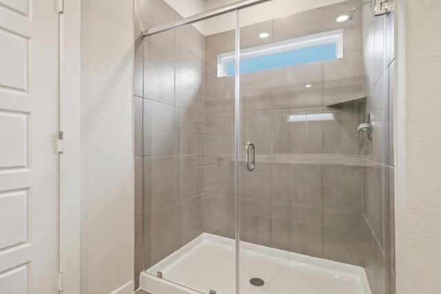 bathroom featuring a shower stall