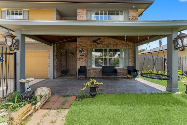 exterior space featuring a garage and covered porch