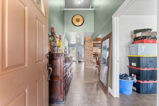 tiled entrance foyer featuring ornate columns