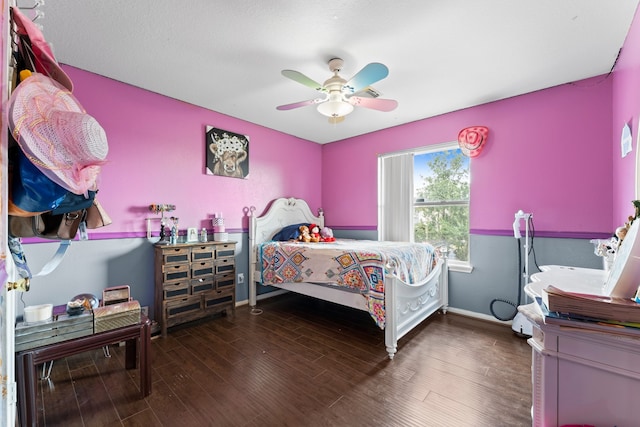 bedroom featuring dark hardwood / wood-style flooring and ceiling fan