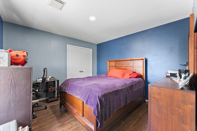 bedroom featuring dark hardwood / wood-style floors