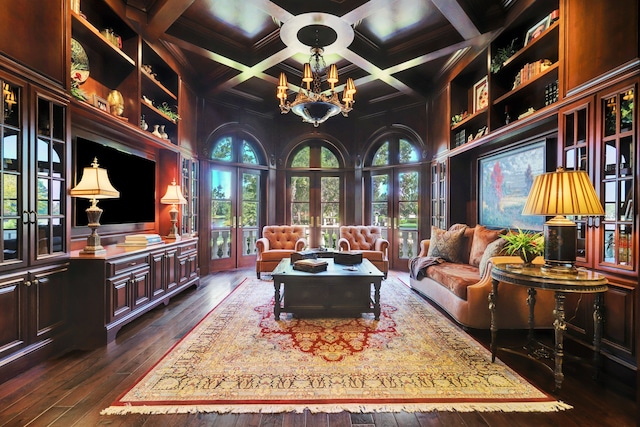 sitting room with dark hardwood / wood-style floors, plenty of natural light, and french doors