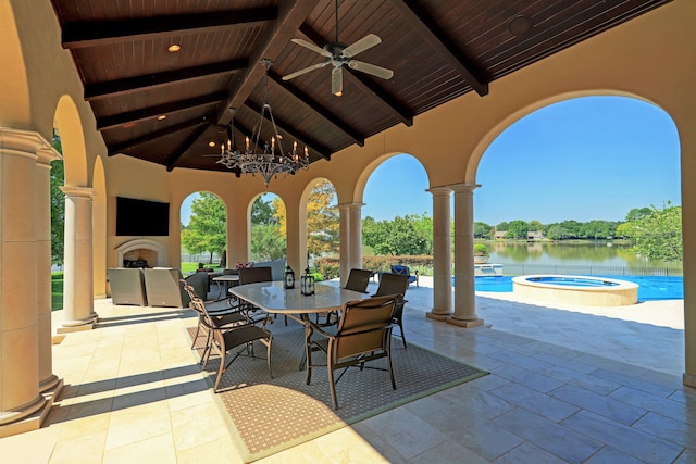 view of patio / terrace featuring a gazebo, a swimming pool with hot tub, and ceiling fan