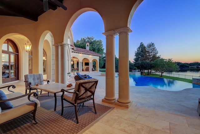 view of patio terrace at dusk