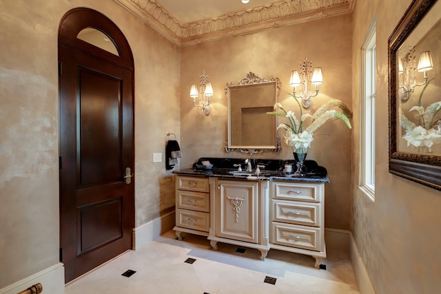 bathroom featuring ornamental molding, vanity, and tile patterned floors