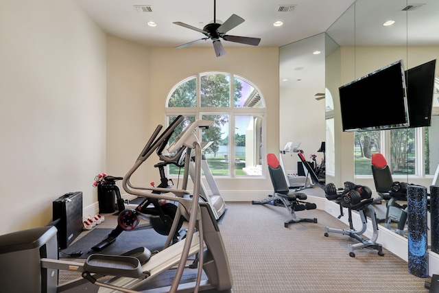 exercise room with carpet flooring and ceiling fan