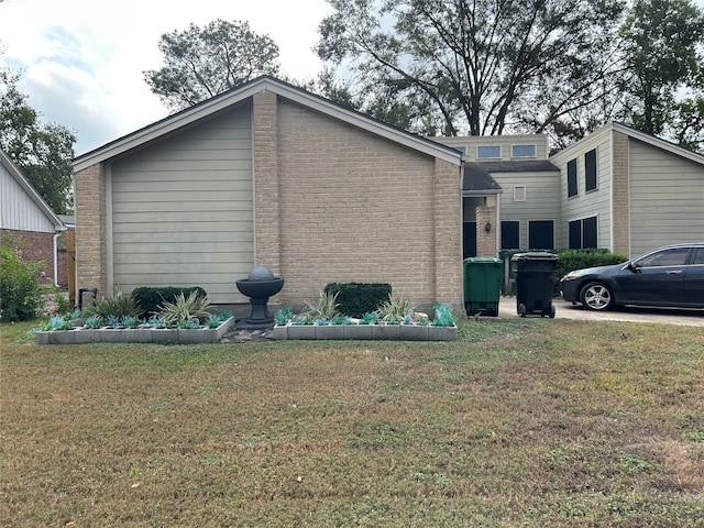 view of home's exterior featuring a lawn