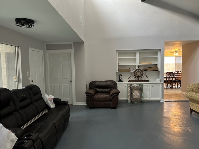 living room featuring concrete flooring