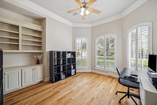 office area featuring a wealth of natural light, light hardwood / wood-style flooring, ornamental molding, and ceiling fan