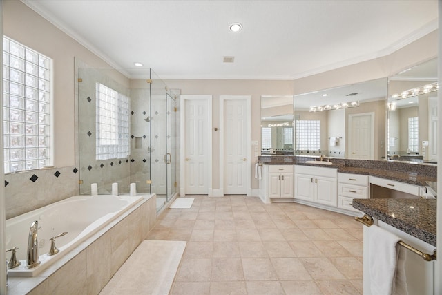 bathroom featuring tile patterned flooring, vanity, shower with separate bathtub, and ornamental molding