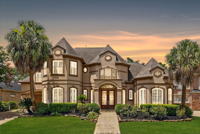 exterior space with a yard and french doors