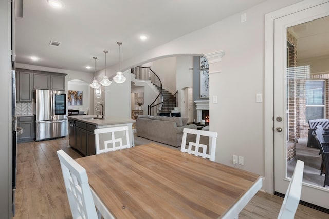 dining area featuring hardwood / wood-style flooring and sink