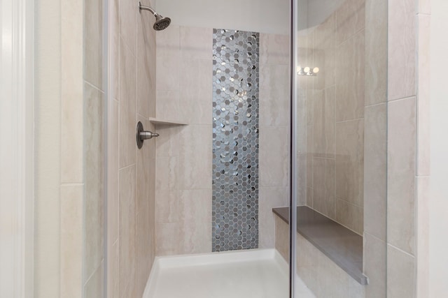 bathroom with tiled shower