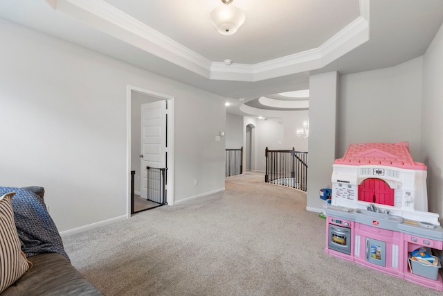 game room with carpet floors, crown molding, and a tray ceiling