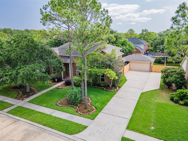 view of front of home with a garage and a front lawn