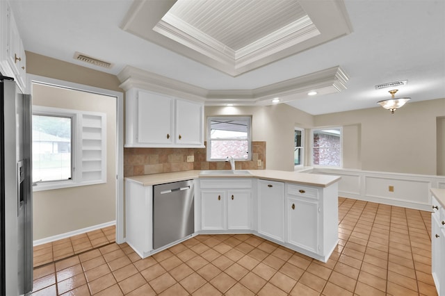 kitchen featuring white cabinets, a wealth of natural light, stainless steel appliances, and sink