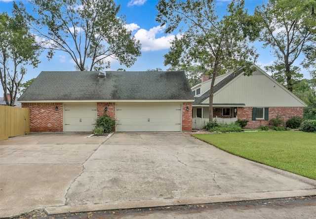 view of front facade with a garage and a front lawn