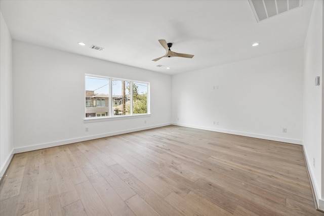 empty room featuring ceiling fan and light wood-type flooring