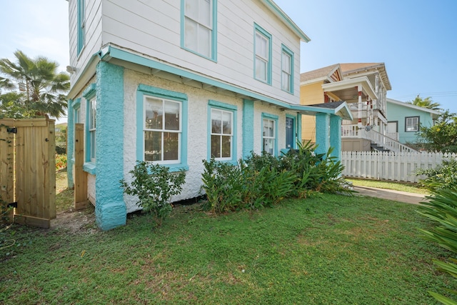 view of home's exterior featuring a lawn