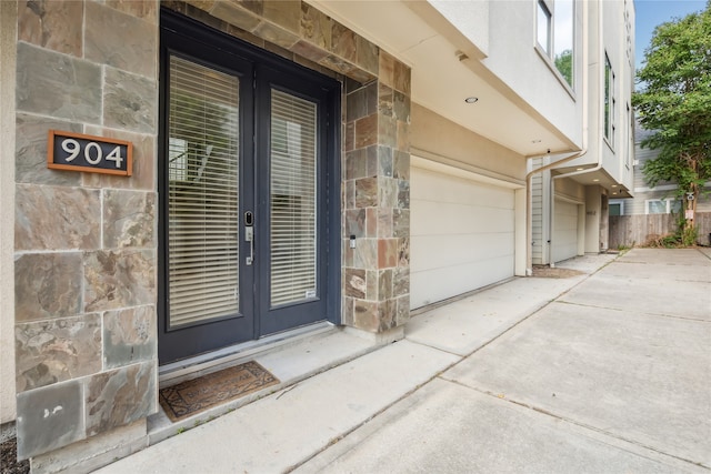 view of exterior entry with a garage