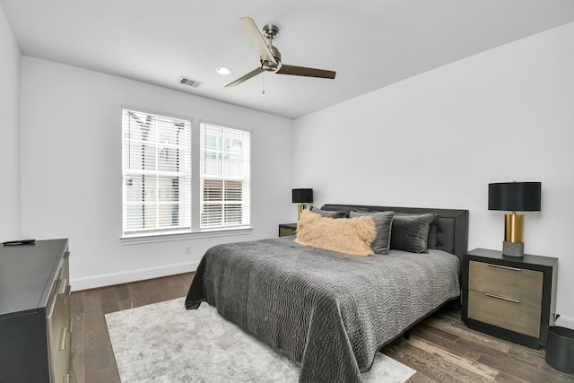 bedroom with ceiling fan and dark hardwood / wood-style floors