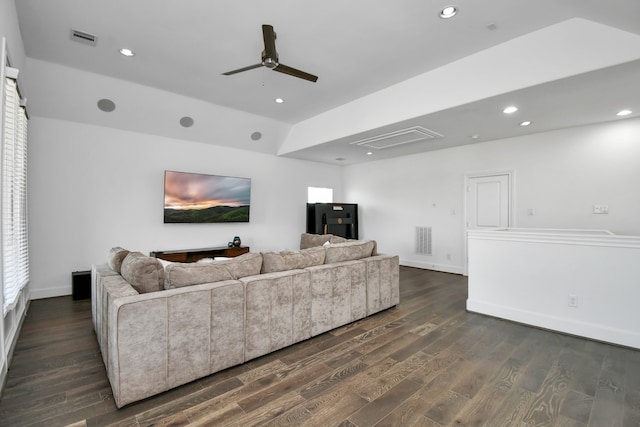 living room featuring dark hardwood / wood-style flooring and ceiling fan