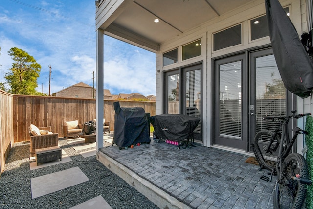 view of patio / terrace with an outdoor hangout area, grilling area, and french doors