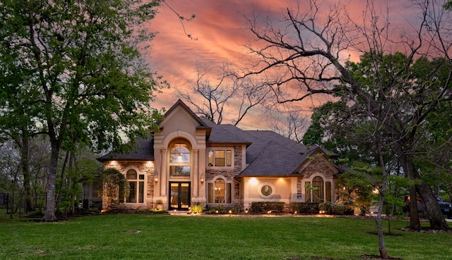 view of front of property with a yard