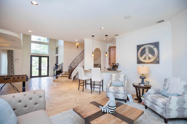 66 Bees Creek Rd, Missouri City, TX 77459 - living area featuring crown molding, stairs, arched walkways, recessed lighting, and french doors