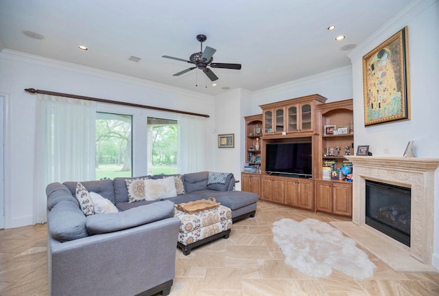 living room featuring ornamental molding and ceiling fan