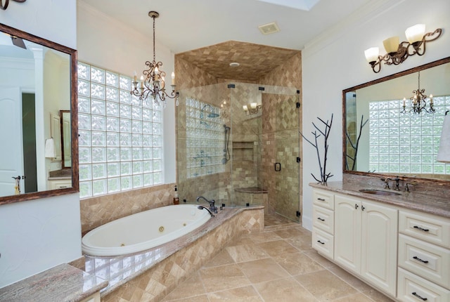 bathroom featuring independent shower and bath, vanity, crown molding, and decorative columns