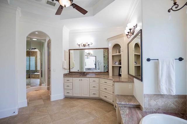 bathroom featuring built in shelves, vanity, ceiling fan, and crown molding