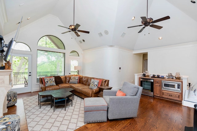 living room with high vaulted ceiling, a wealth of natural light, wood-type flooring, and wine cooler