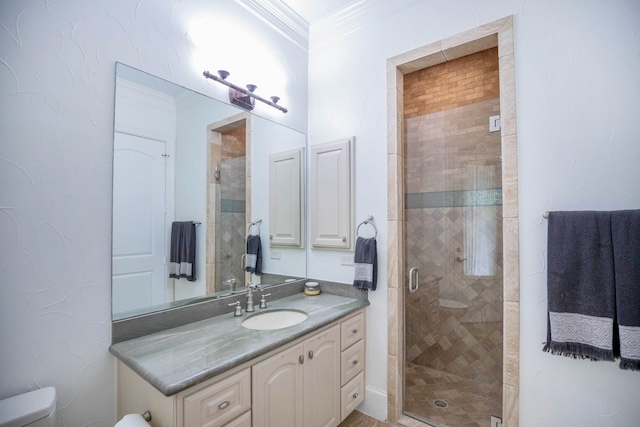 bathroom featuring vanity, toilet, an enclosed shower, and ornamental molding