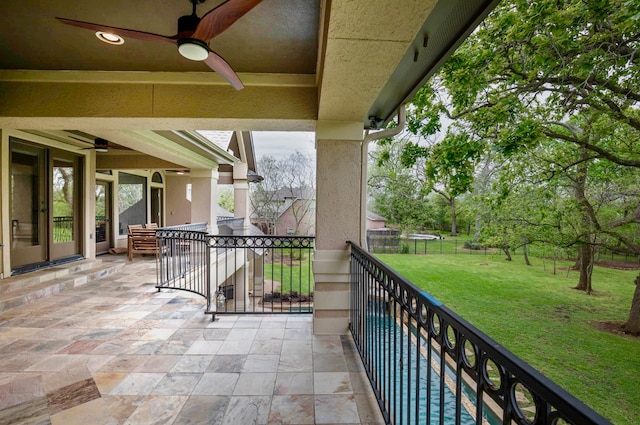 balcony with ceiling fan and a patio area