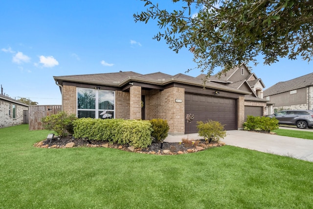 view of front facade featuring a garage and a front yard