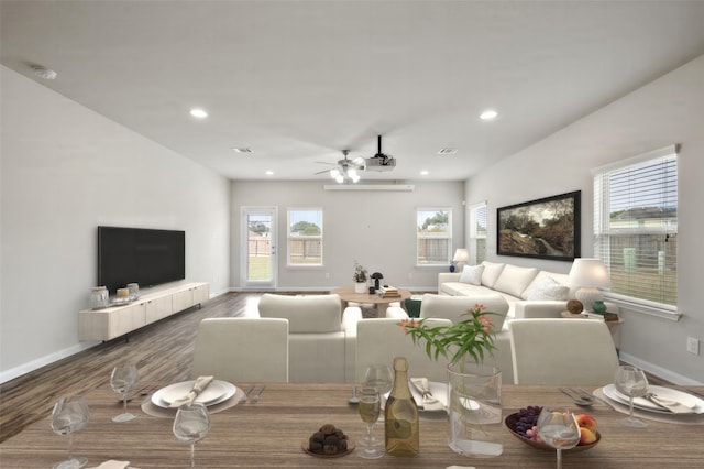 living room featuring hardwood / wood-style flooring and ceiling fan