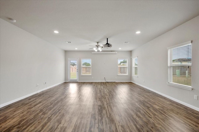 spare room featuring ceiling fan and dark hardwood / wood-style flooring