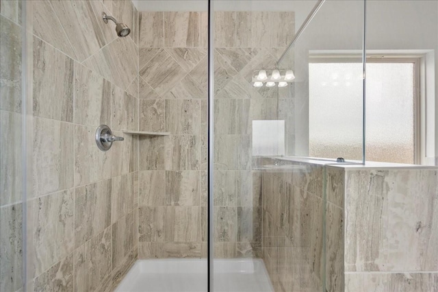 bathroom featuring tiled shower